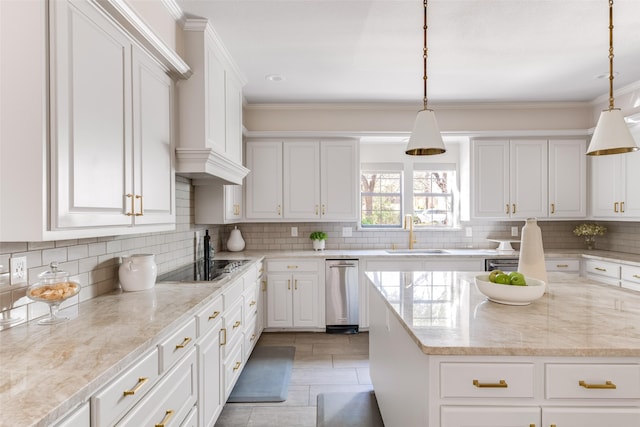 kitchen featuring ornamental molding, light stone counters, decorative backsplash, white cabinets, and a sink