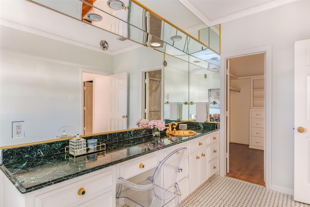 bathroom featuring vanity and crown molding