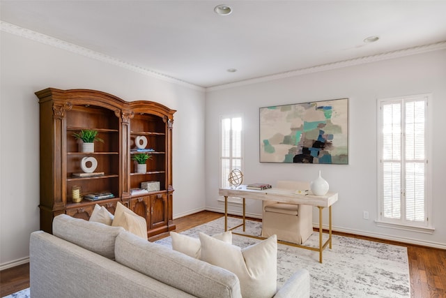 living room with wood finished floors, baseboards, and a wealth of natural light