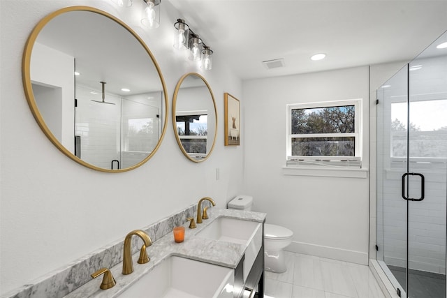 bathroom featuring visible vents, a shower stall, baseboards, toilet, and vanity