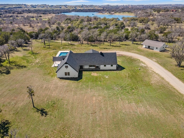 birds eye view of property with a water view