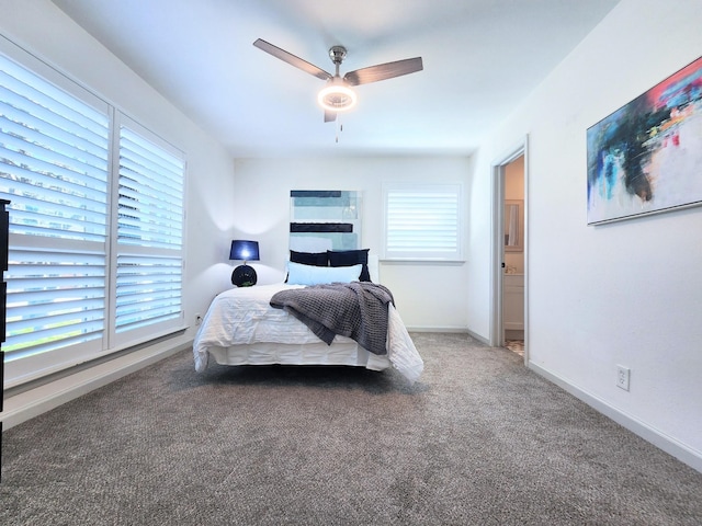 carpeted bedroom with a ceiling fan and baseboards