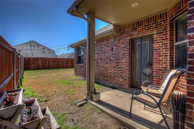 view of yard featuring a patio area and a fenced backyard