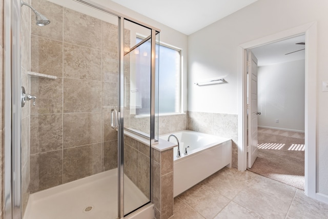 full bathroom with a bath, a shower stall, and tile patterned flooring