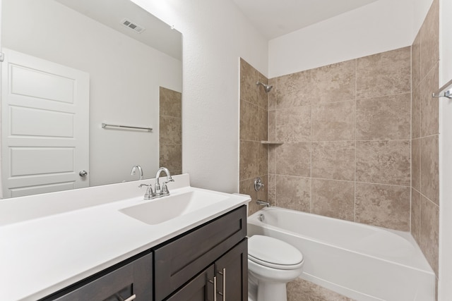 full bathroom with visible vents, vanity, toilet, and  shower combination