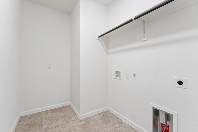 clothes washing area featuring baseboards, gas dryer hookup, laundry area, electric dryer hookup, and washer hookup