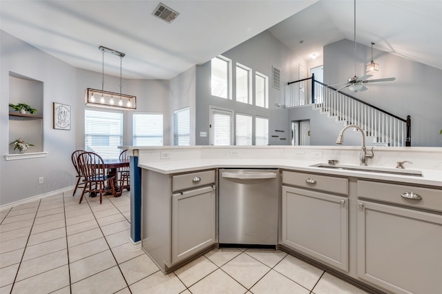 kitchen with visible vents, gray cabinetry, a sink, stainless steel dishwasher, and light tile patterned flooring