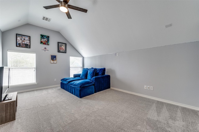 living area featuring visible vents, carpet, baseboards, ceiling fan, and vaulted ceiling