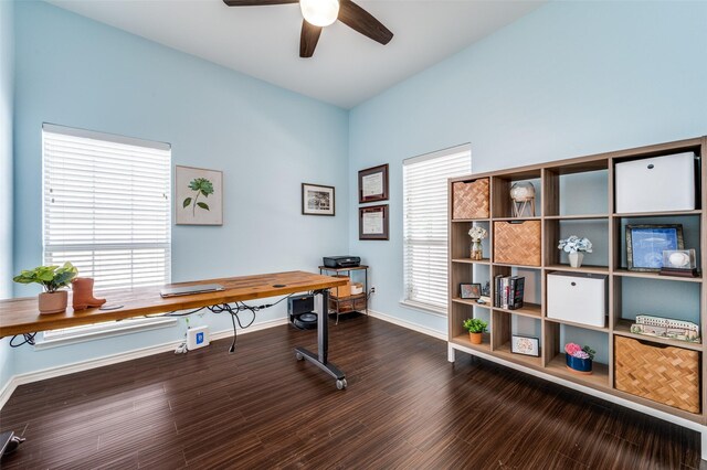 office featuring plenty of natural light, ceiling fan, baseboards, and wood finished floors