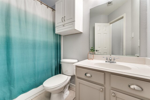 full bath featuring tile patterned floors, visible vents, toilet, curtained shower, and vanity