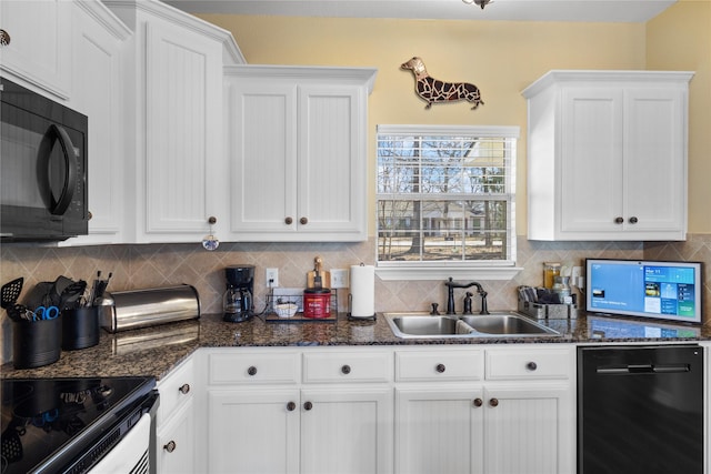 kitchen with decorative backsplash, white cabinetry, black appliances, and a sink