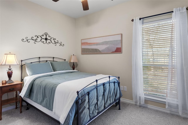 bedroom featuring baseboards, carpet, and ceiling fan