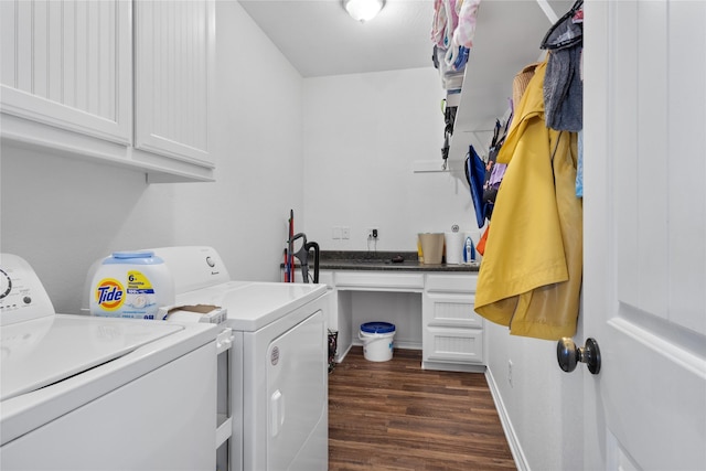 clothes washing area featuring baseboards, cabinet space, dark wood-style flooring, and washer and clothes dryer