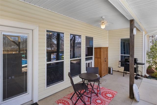 view of patio featuring a grill and a ceiling fan