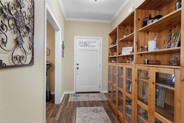 interior space featuring wood finished floors, baseboards, and ornamental molding