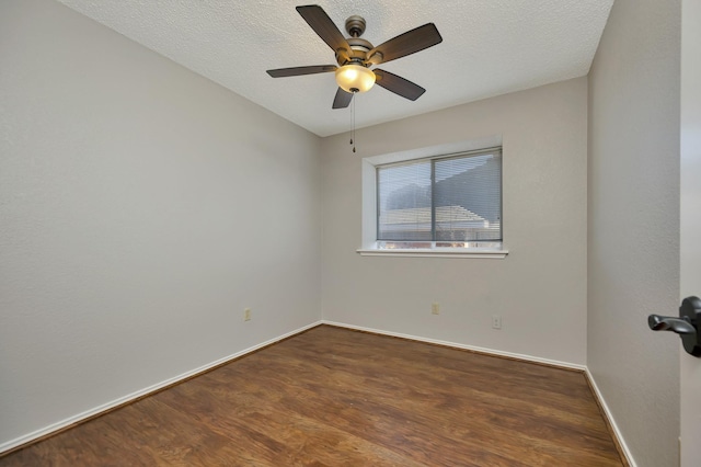 unfurnished room with a textured ceiling, a ceiling fan, baseboards, and wood finished floors