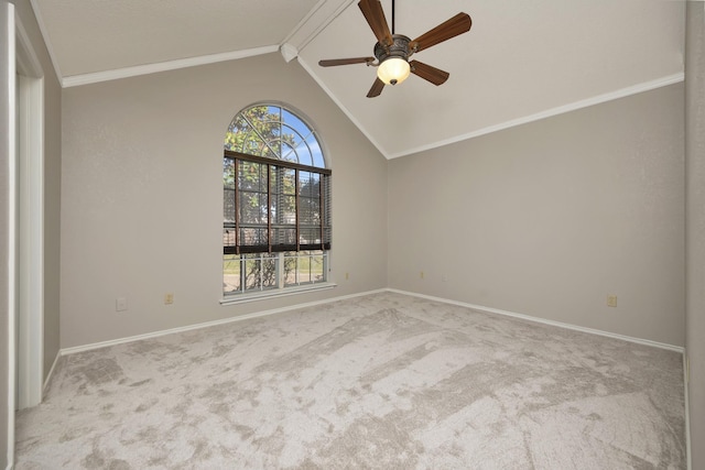 carpeted spare room featuring baseboards, lofted ceiling, a ceiling fan, and crown molding