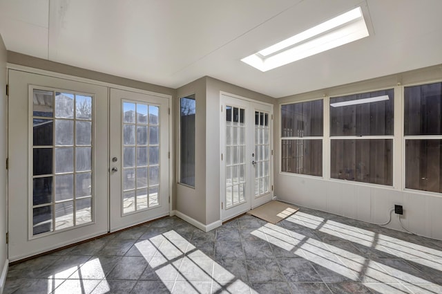 unfurnished sunroom featuring french doors and vaulted ceiling