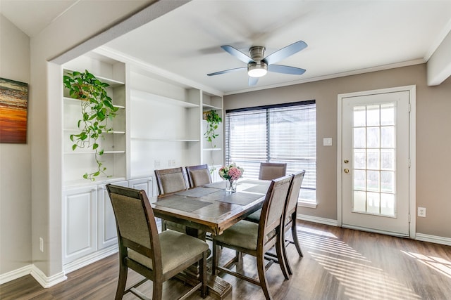 dining room with built in features, baseboards, dark wood-style floors, and ceiling fan