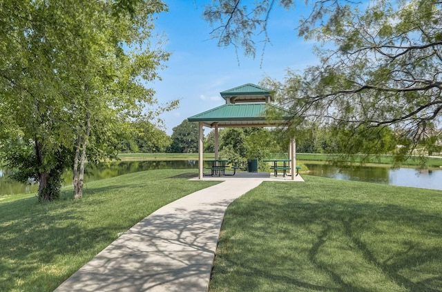 surrounding community featuring a gazebo, a yard, and a water view