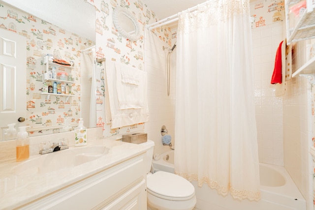 bathroom featuring toilet, wallpapered walls, vanity, and shower / bath combo