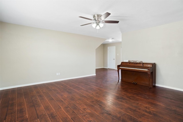 empty room featuring wood-type flooring, ceiling fan, and baseboards