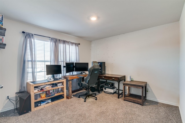 carpeted office featuring baseboards