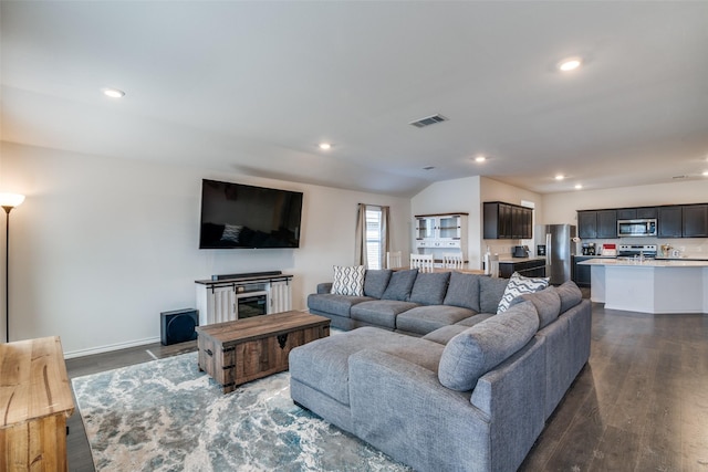 living room featuring recessed lighting, visible vents, and dark wood-style floors