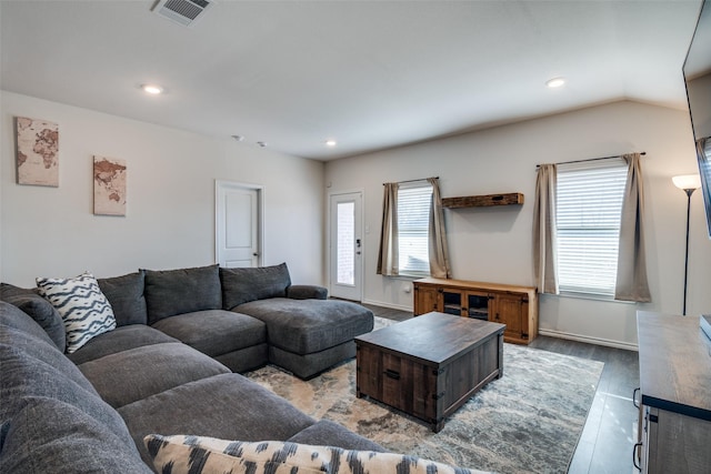 living room featuring visible vents, recessed lighting, baseboards, and wood finished floors