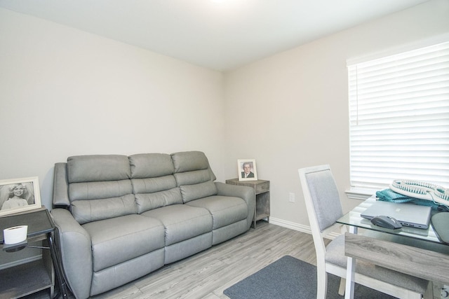 office featuring baseboards and wood finished floors