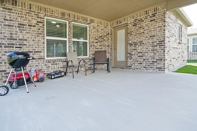 view of patio with a grill