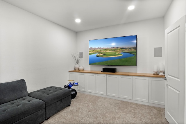 living area featuring carpet flooring and recessed lighting