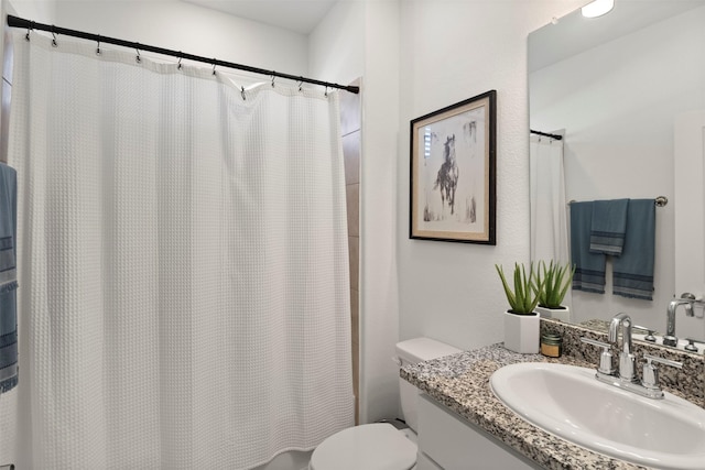 full bath with vanity and toilet