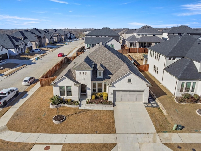 birds eye view of property with a residential view