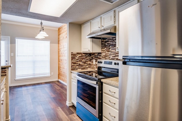 kitchen featuring under cabinet range hood, backsplash, white cabinetry, appliances with stainless steel finishes, and dark wood-style flooring