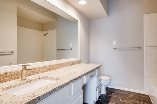 full bath featuring baseboards, wood finish floors, toilet, recessed lighting, and vanity