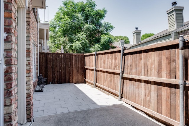 view of patio / terrace featuring fence