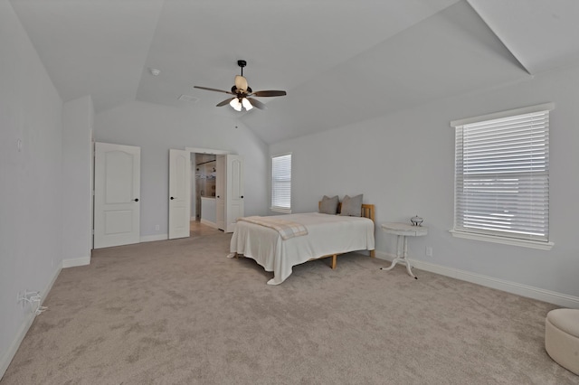 bedroom with baseboards, lofted ceiling, light colored carpet, and visible vents