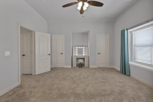 unfurnished bedroom with baseboards, carpet floors, and ceiling fan