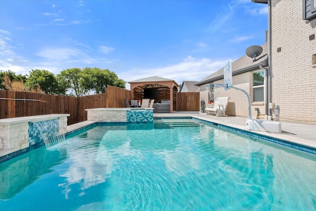 view of swimming pool featuring a gazebo, a fenced backyard, a fenced in pool, and a patio area