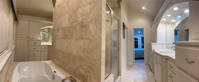 bathroom featuring a garden tub, recessed lighting, a stall shower, and vanity