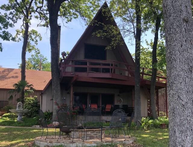back of property with a patio area