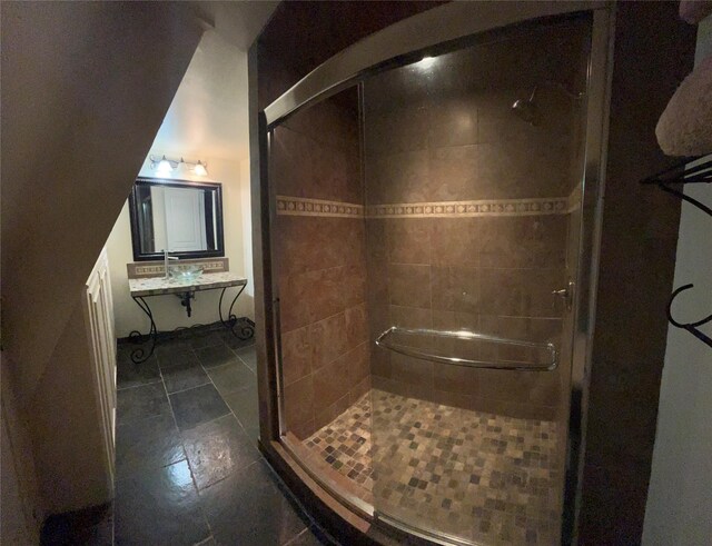 full bath featuring vanity, tile patterned flooring, and a stall shower
