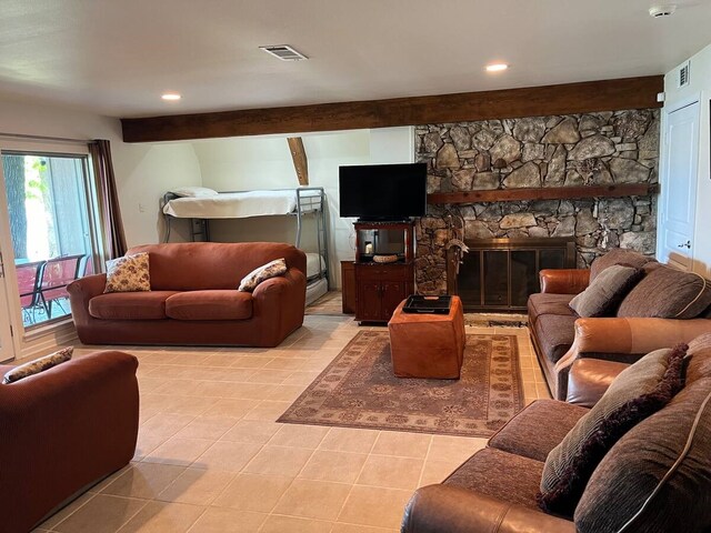 tiled living area featuring recessed lighting, beamed ceiling, visible vents, and a fireplace
