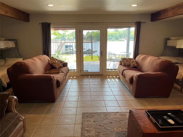 living area featuring light tile patterned flooring and recessed lighting
