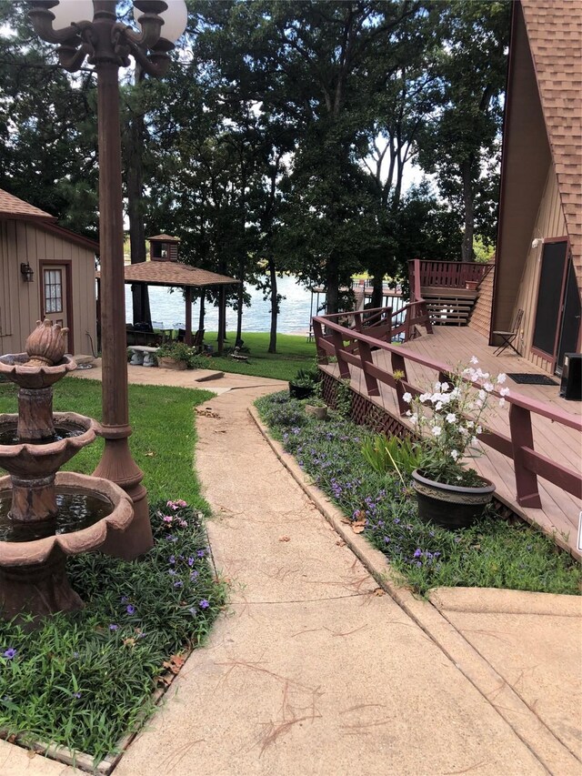 view of yard with a gazebo and a wooden deck