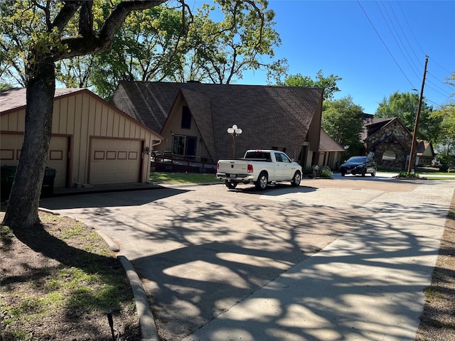 7045 Layman Dr, Eustace, TX 75124 - view of front of house with board and batten siding and a detached garage
