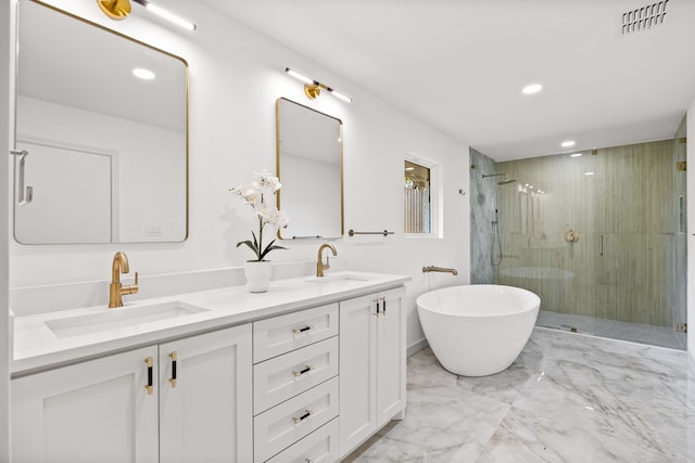 bathroom featuring visible vents, a stall shower, marble finish floor, and a sink