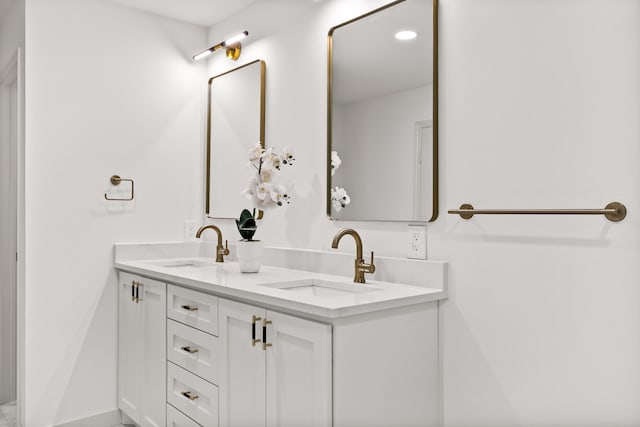 bathroom featuring double vanity and a sink