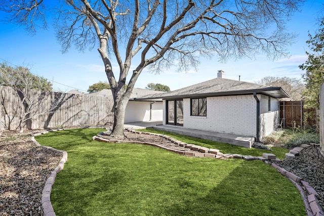 exterior space with a patio and a fenced backyard